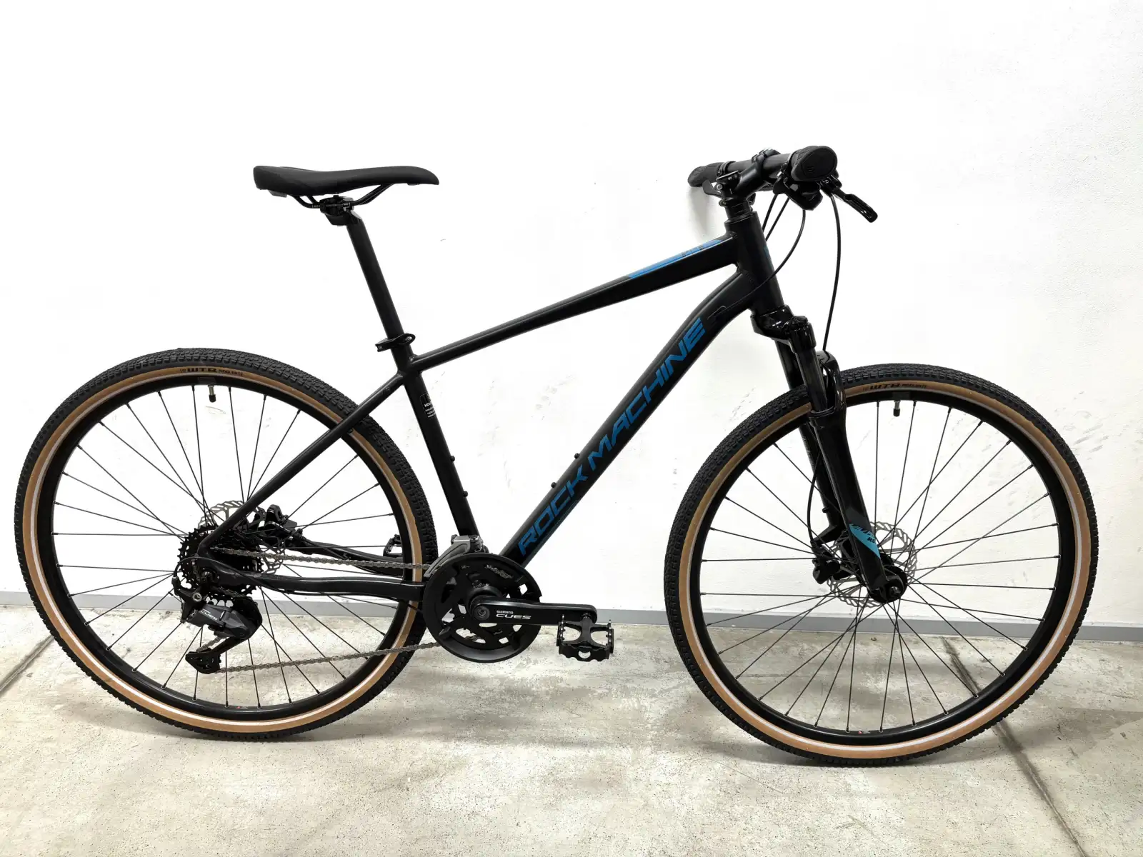 Rock Machine CrossRide 700 Trekkingrad black/petrol MUSTER