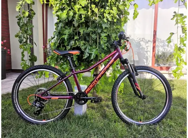 Rock Machine Catherine 24 VB Mountainbike in Gloss Crimson/Orange/Crimson.